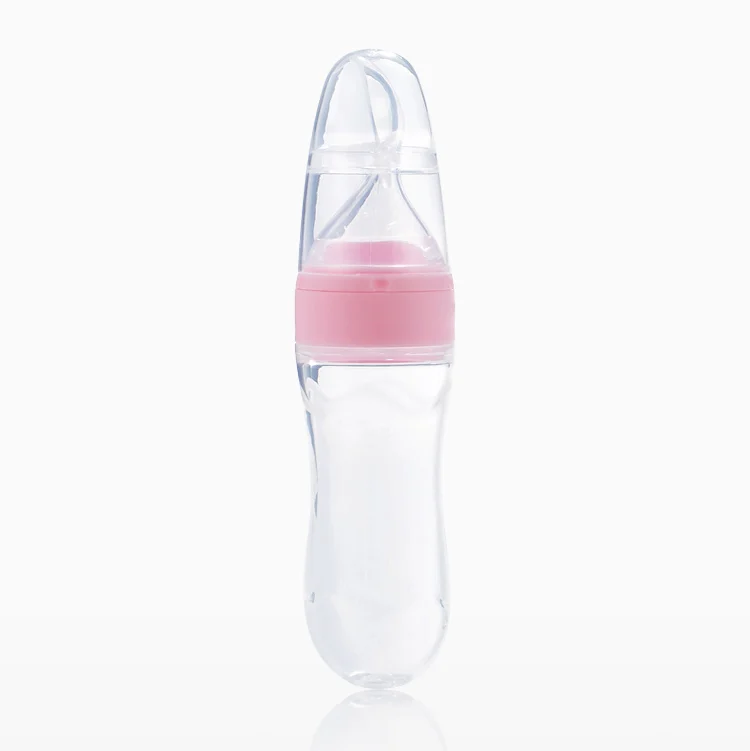 White 90ml silicone squeeze feeder with spoon and cap in place