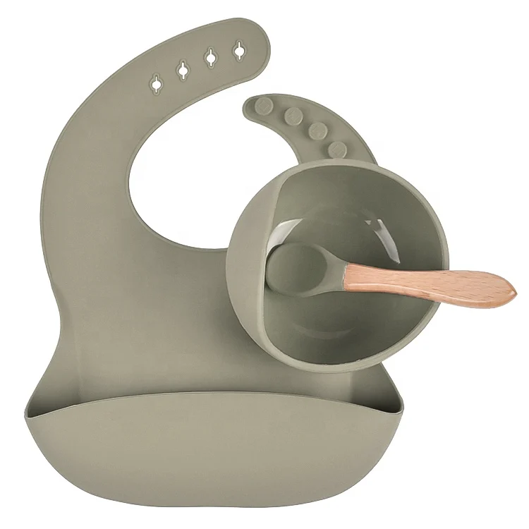 Baby feeding set laid out on a table with all components visible