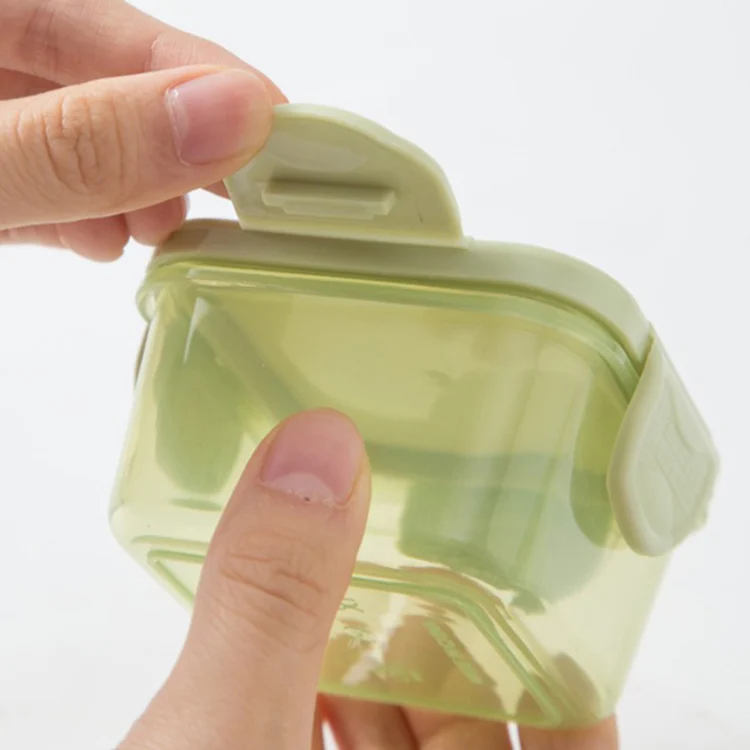 Plastic baby food container in a freezer compartment