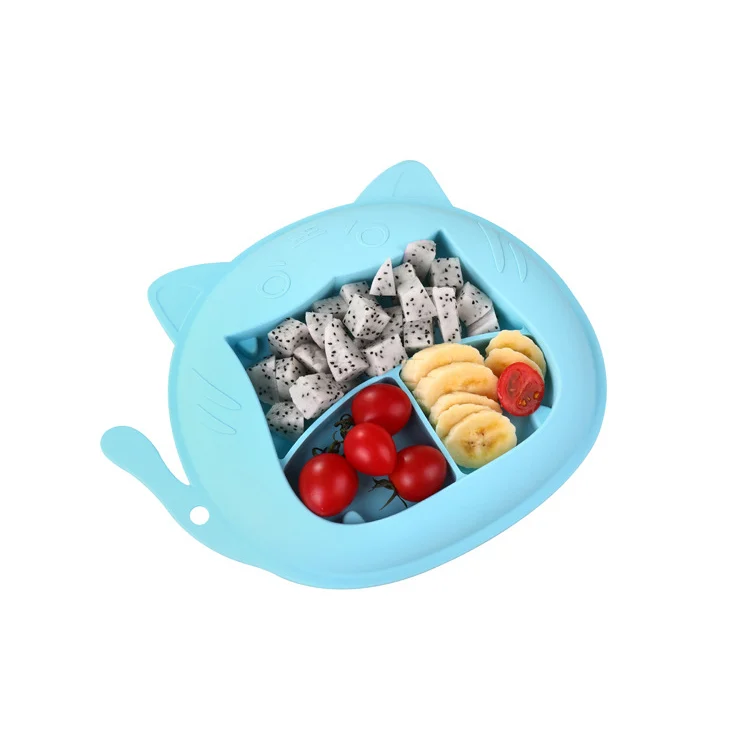Plate placed on a high chair tray with food in each compartment