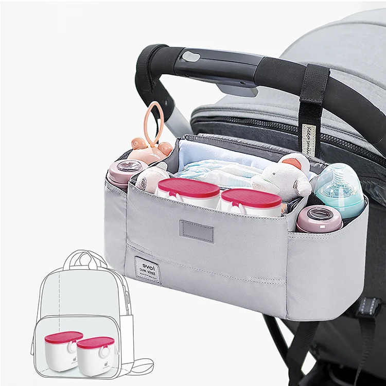 Dispenser placed on a stroller with the handle hanging down