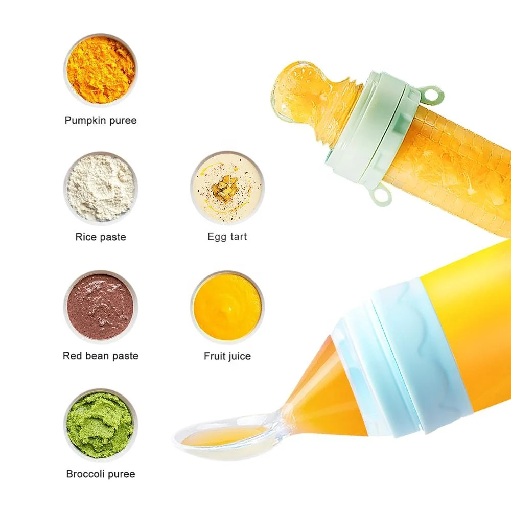 Green baby feeding set with the squeeze feeder open and filter lid in place