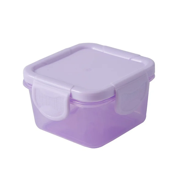 Stack of three plastic baby food storage boxes in different colours