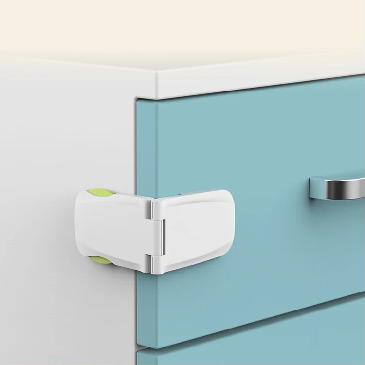 Pink safety lock mounted on a kitchen cabinet