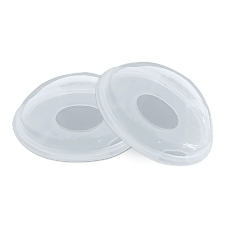 Silicone breast collector worn inside a bra, demonstrating fit and positioning