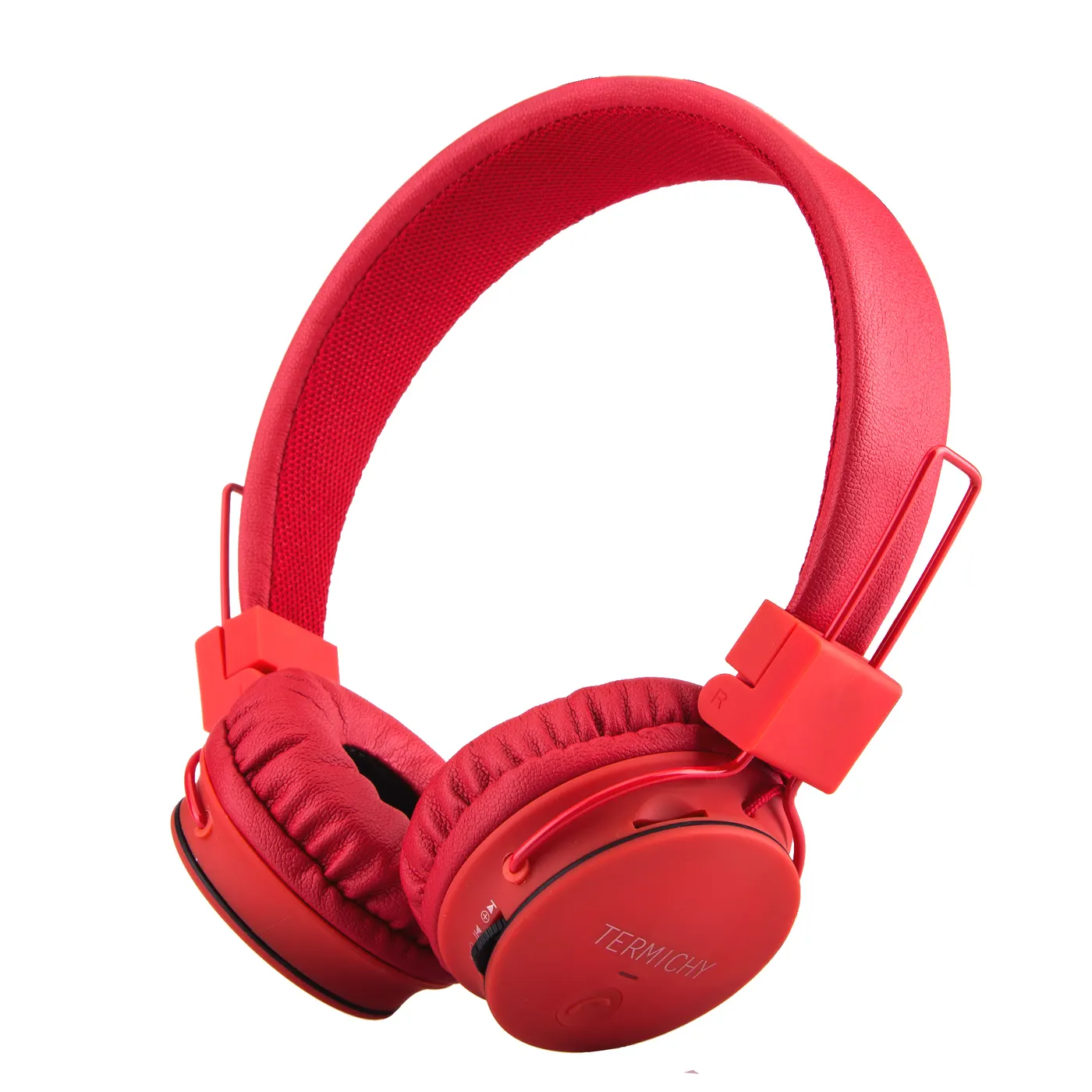 Green kids' headphones placed on a table with TF card and FM radio features
