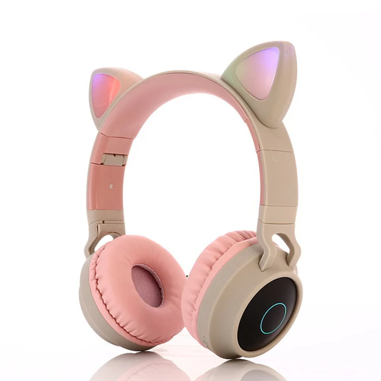Green cat ear headphones with the ear pad removed to show internal structure