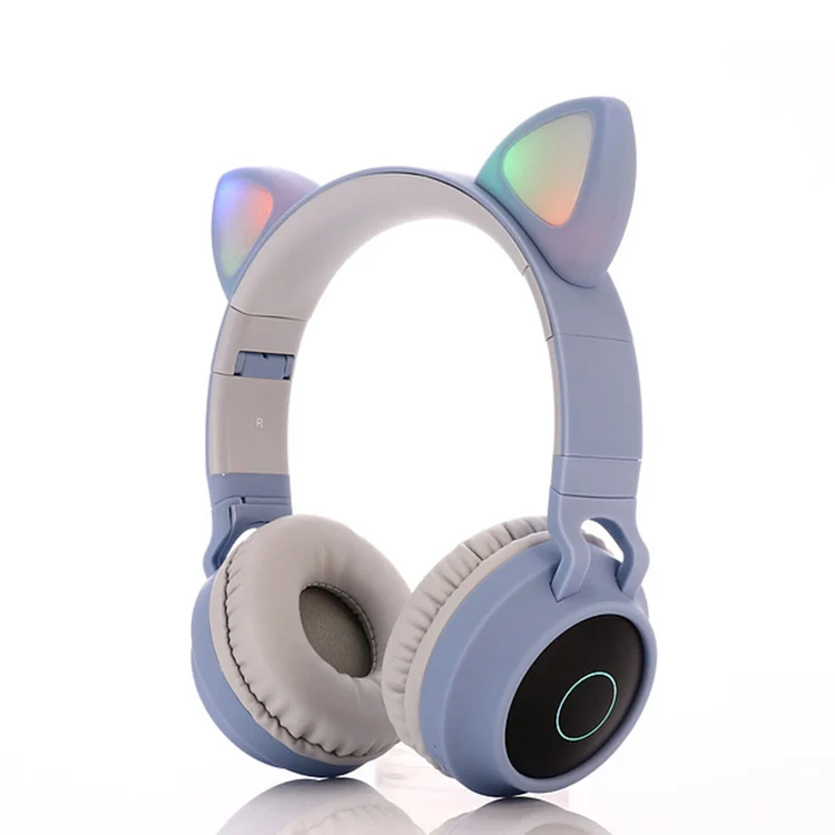 Red cat ear headphones on a stand with the cord coiled
