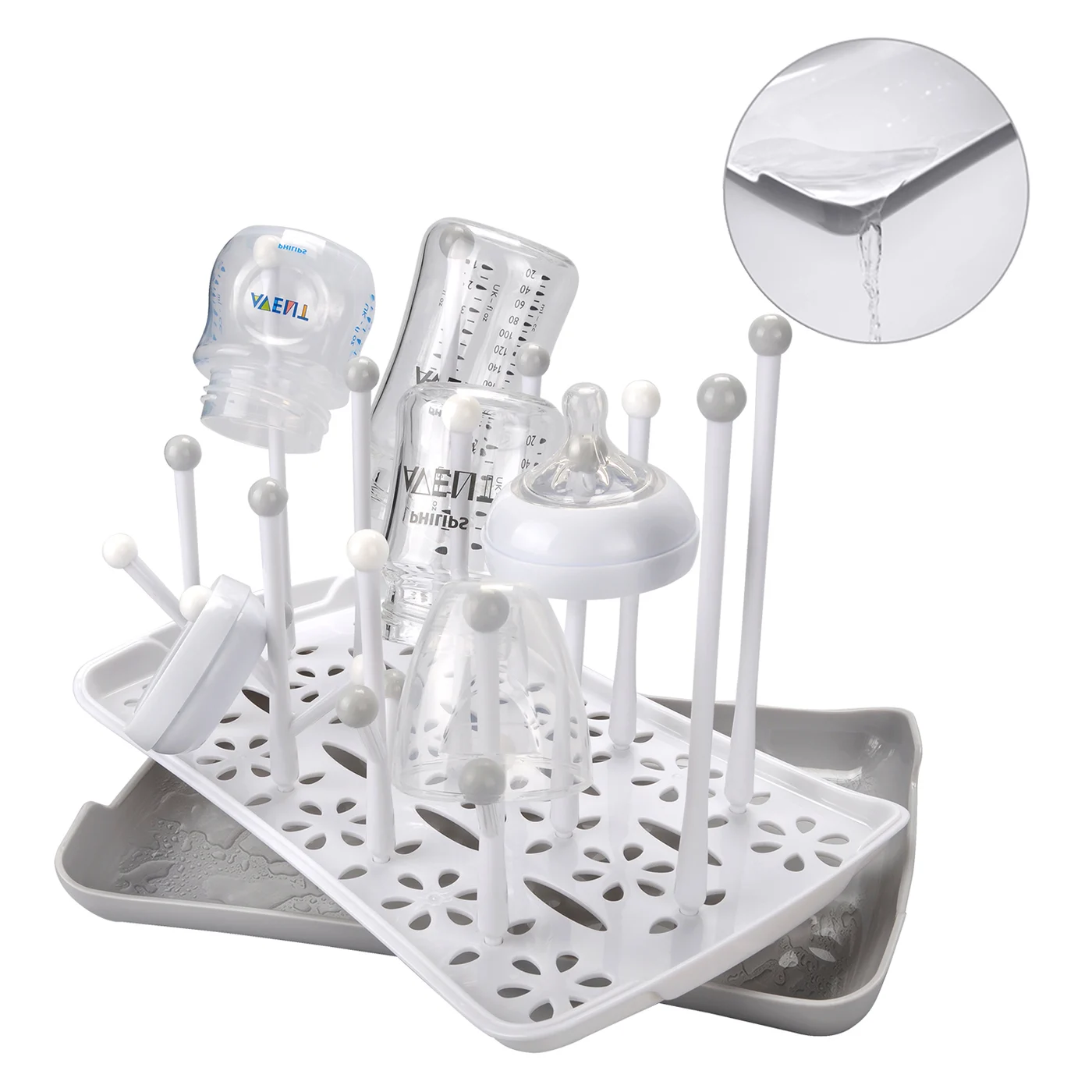 Pink baby bottle drying rack with the drawstring pocket visible on the side