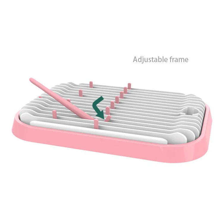 Drying rack with a nipple and valve on the side arm, demonstrating accessory support