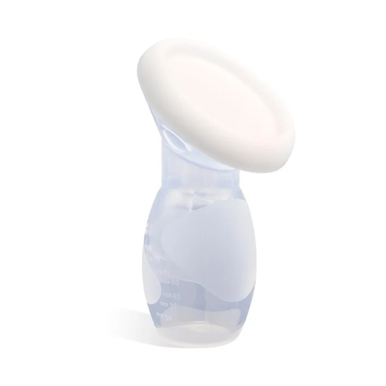 Manual breast pump in use with a hand squeezing the body