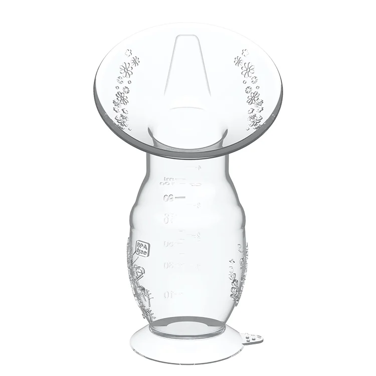 Silicone breast pump placed on a flat surface with a colour box beside it