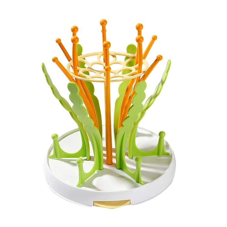 Pink baby bottle drying rack with removable drip tray in water-catching position