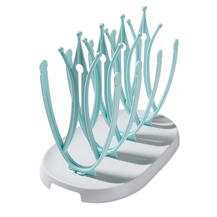 Blue baby bottle drying rack with bottles and accessories placed upright