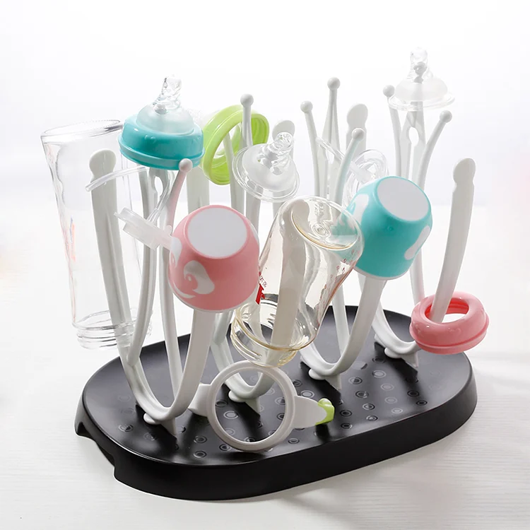 Black baby bottle drying rack with sippy cups and nipples on the tray