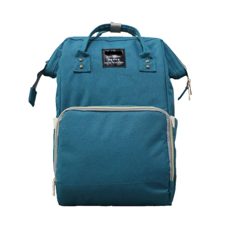 Diaper bag backpack with the front compartment open, showing adjustable dividers