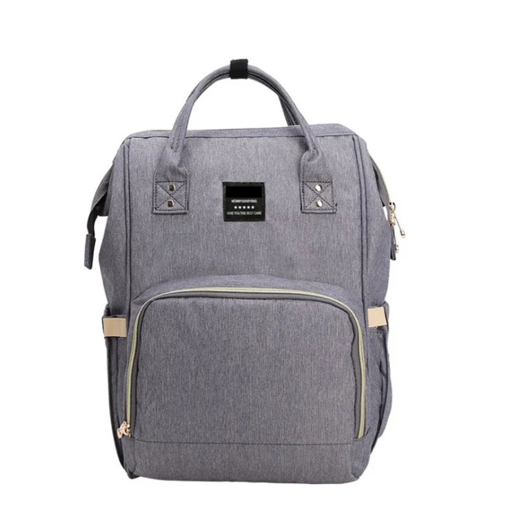 Diaper bag backpack with front view showing 11 storage compartments