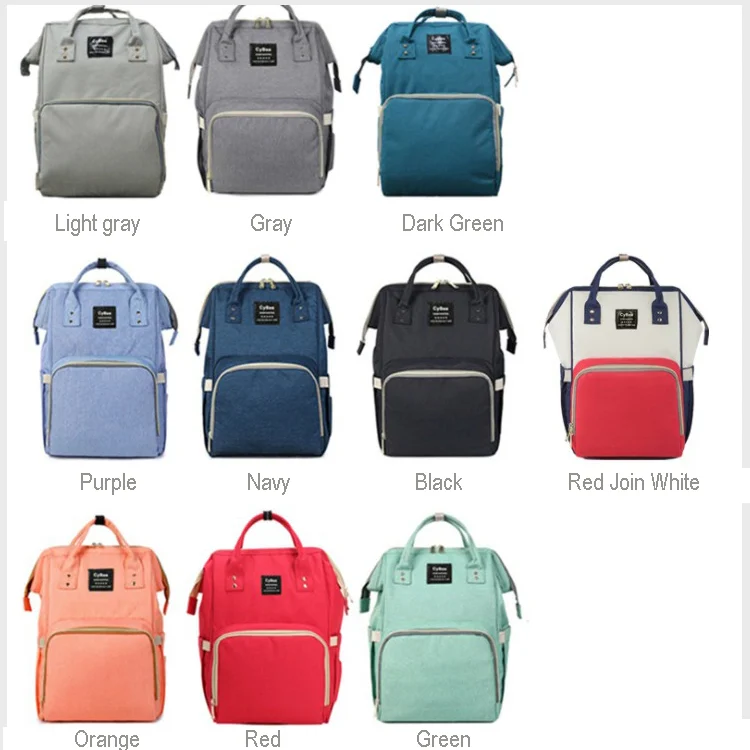 Diaper bag backpack with the rear panel open, revealing the main diaper storage area