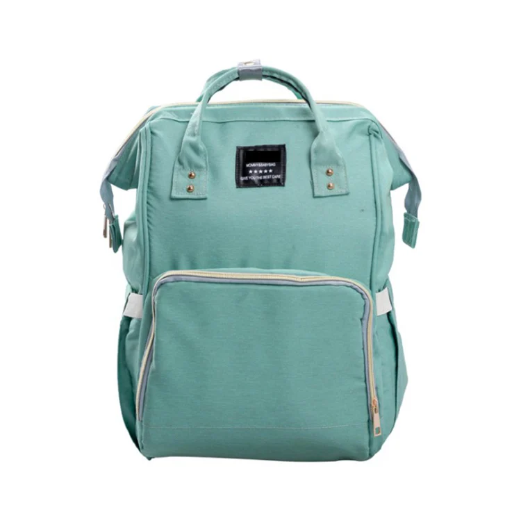 Interior of the diaper bag with the foil-lined pouch and waterproof compartment visible