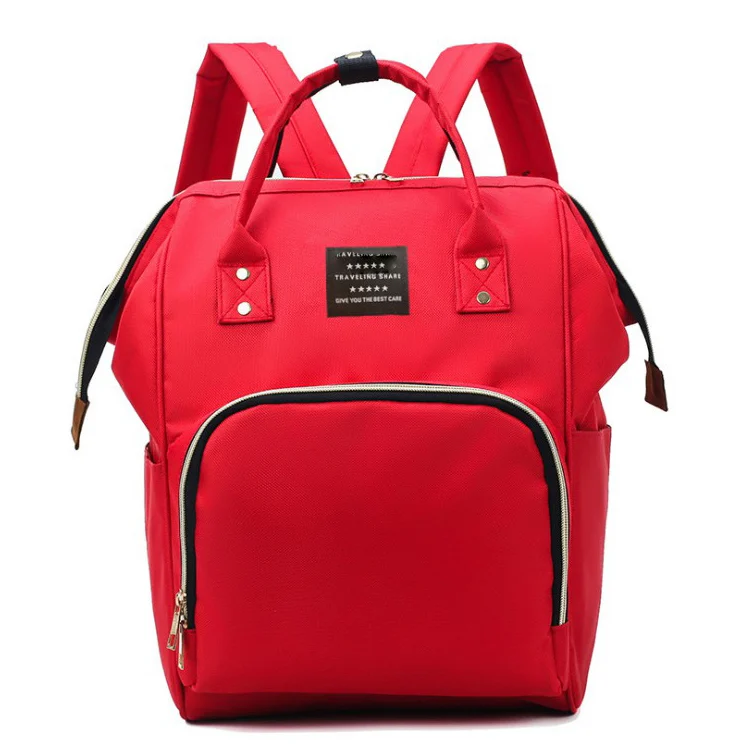 Diaper bag with padded shoulder straps and zippered back flap