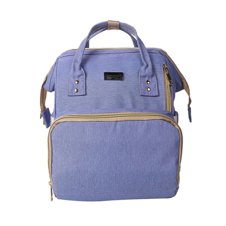 Bag in use on a walk, showing the padded straps and organised contents