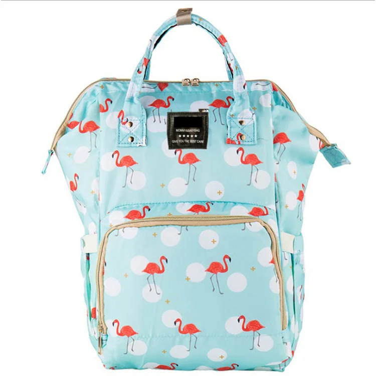 Diaper bag with internal wipe-clean pocket and side mesh pocket