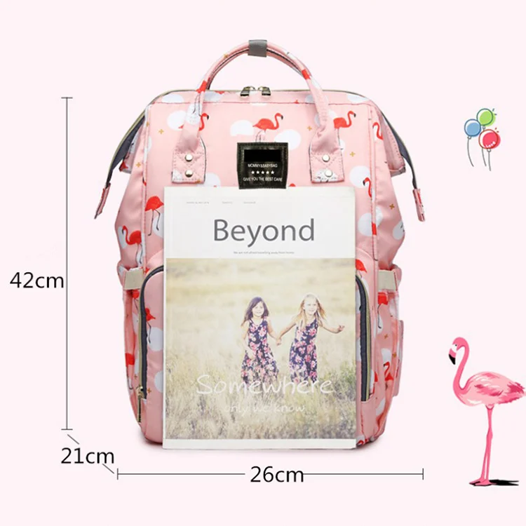 Diaper bag being carried by a parent with adjustable straps