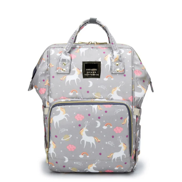 Diaper bag with zippered back flap and adjustable shoulder straps