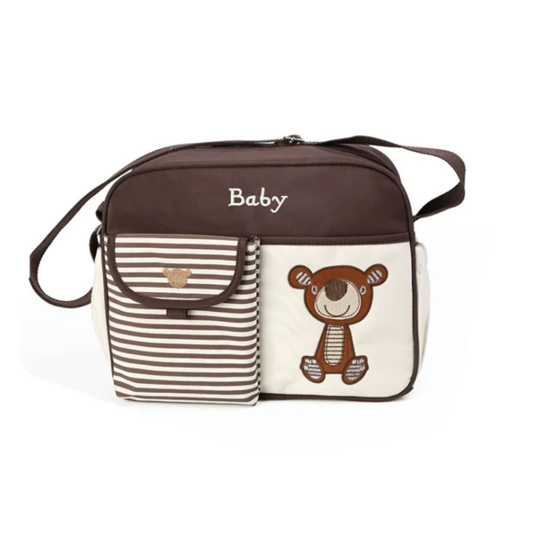 Mini baby nursery nappy diaper shoulder bag with close-up of flap and closure