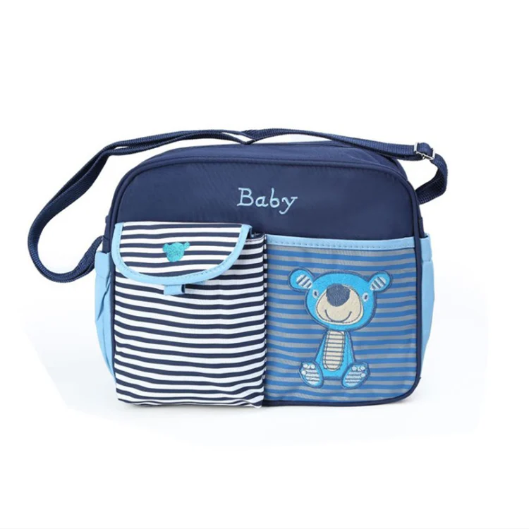 Mini baby nursery nappy diaper shoulder bag attached to a stroller handle