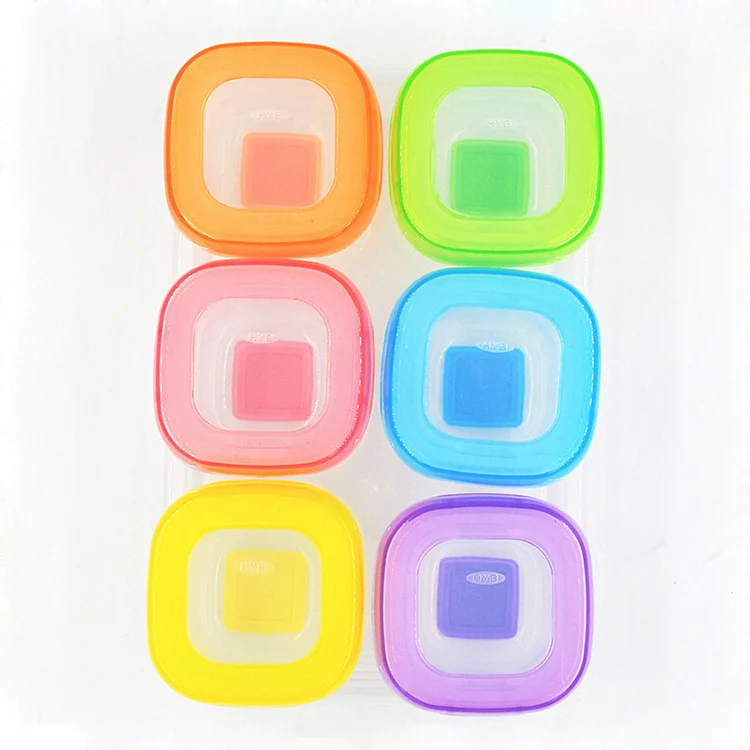 Four 120ml baby food storage containers with lids open, showing measurement markings