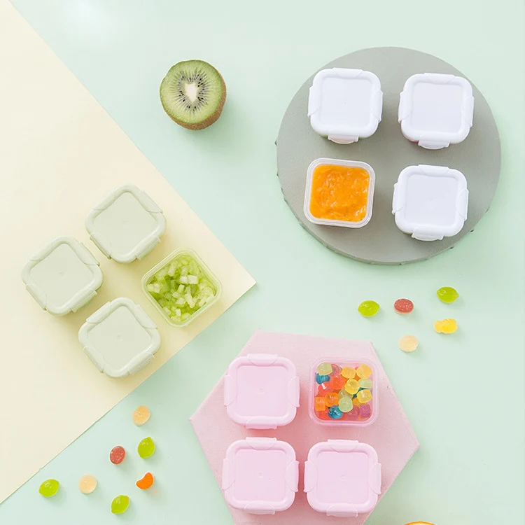 White 60ml baby food storage container with closed lid, standing upright