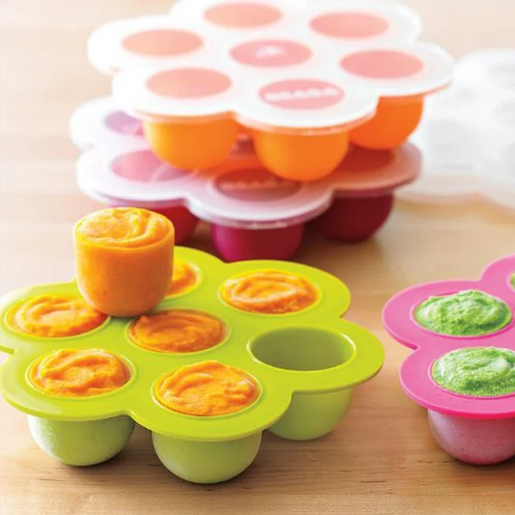 Orange silicone tray with lid open, displaying the animal design on each cavity