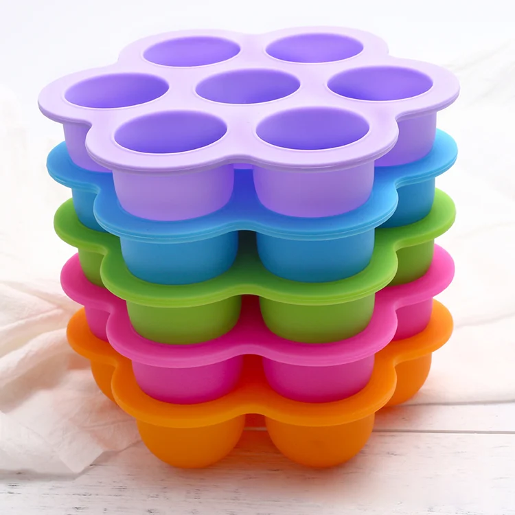 Blue silicone ice ball mould with lid, showing seven animal-shaped cavities