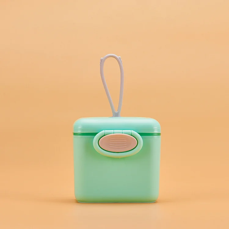 Green formula dispenser standing upright with scoop removed