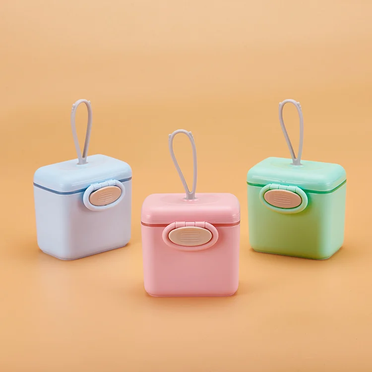 Formula dispenser with scoop inside the lid holder, side view