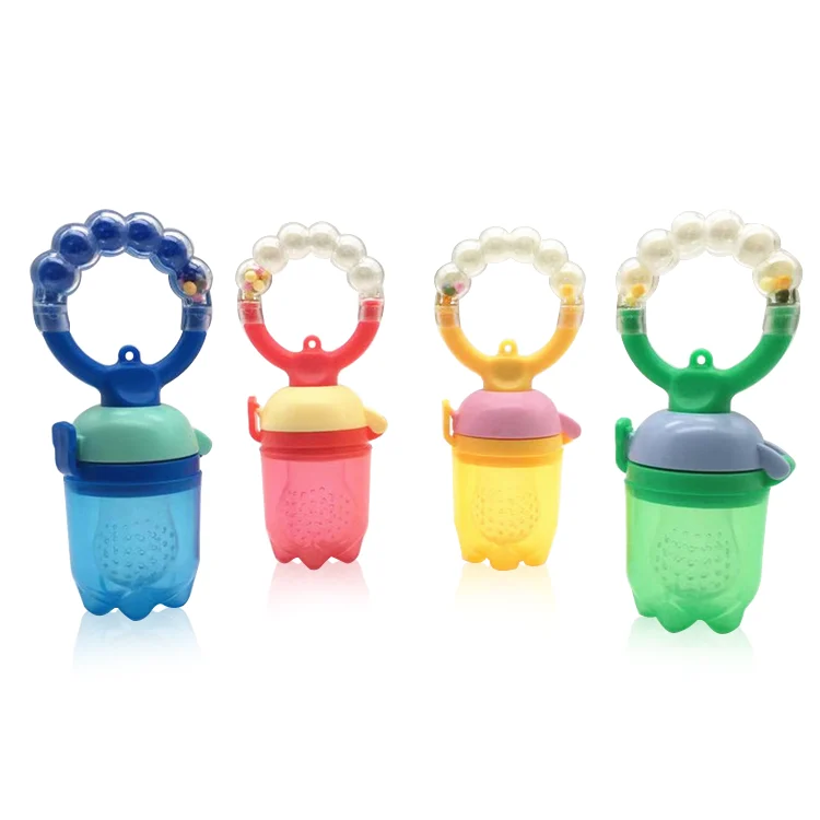 Baby food feeder with the mesh filled with chopped fruit