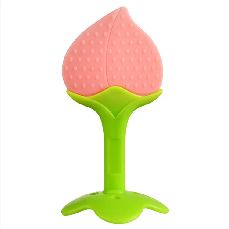 Six colorful silicone fruit-shaped teethers laid out in a row, showing different shapes and colors