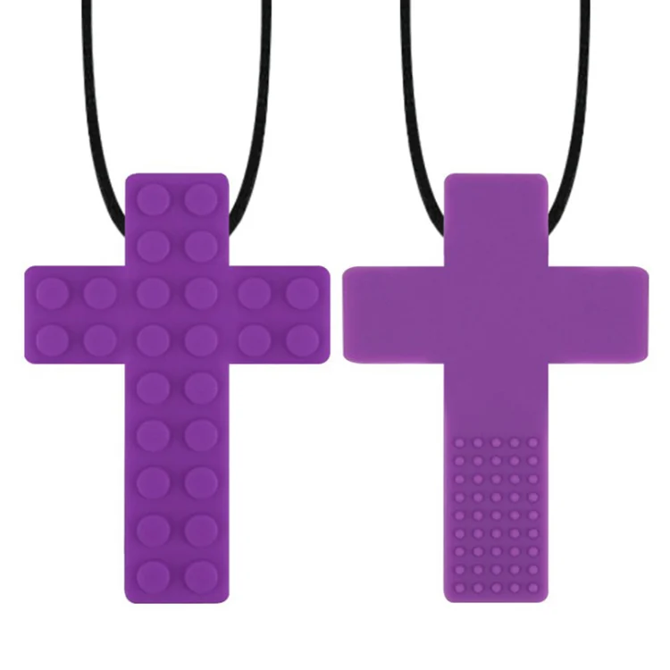Multiple chew necklaces in different colours laid out side by side