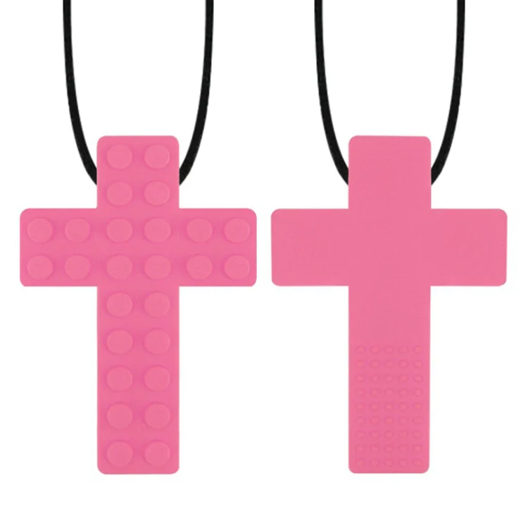 Silicone chew necklace laid flat with visible stud patterns