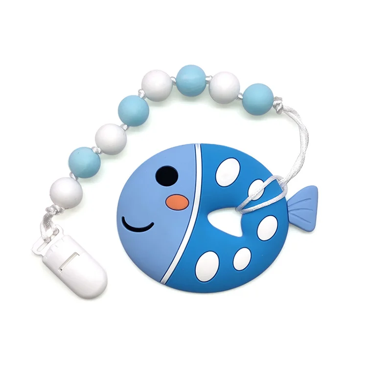 Fish-shaped silicone teether with beads, pink colour, standing upright