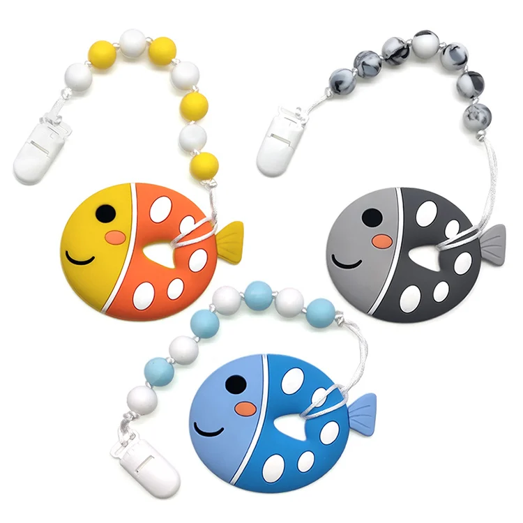 Fish-shaped silicone teether with beads, yellow colour, in OPP bag packaging