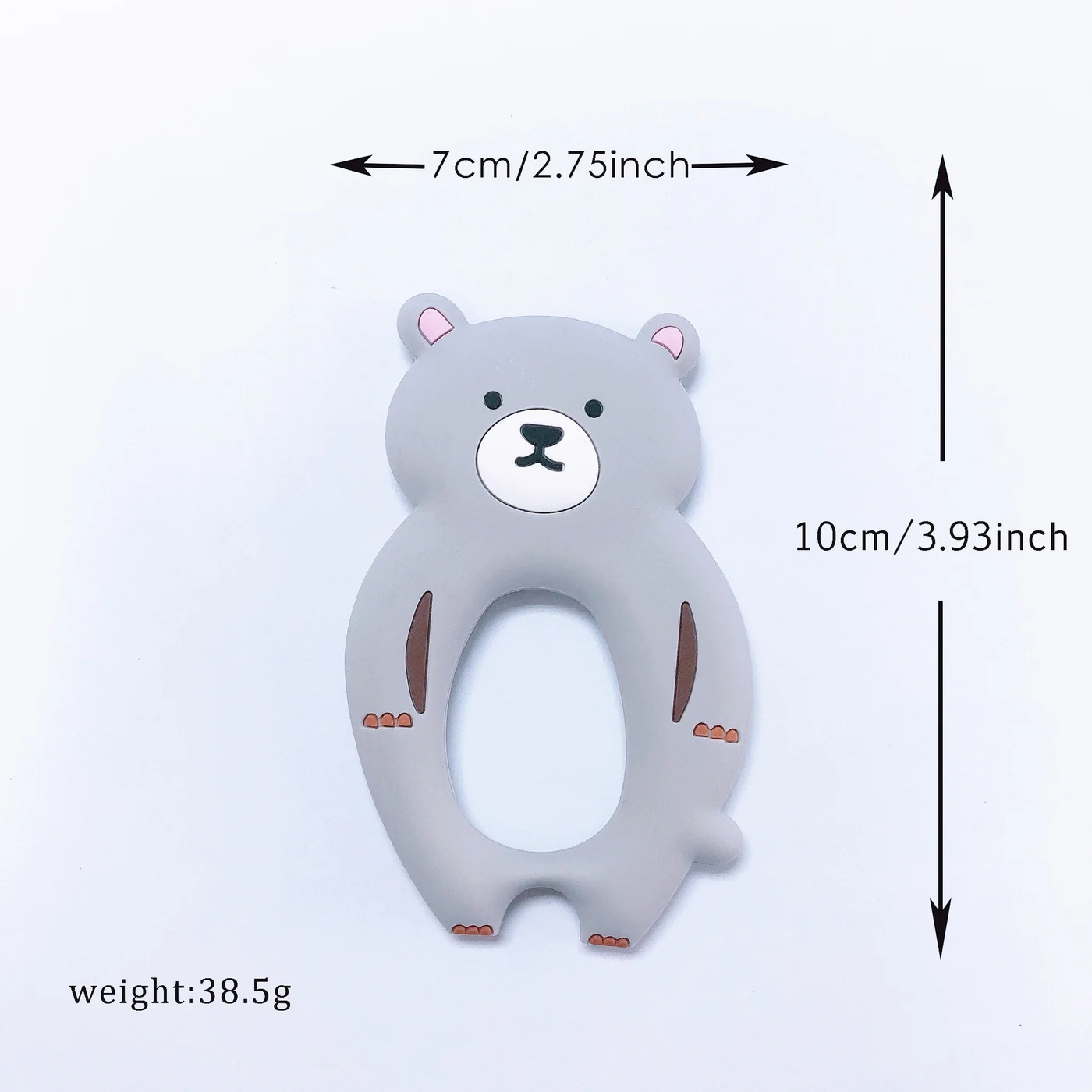 Teether with the clip in use on a baby's bottle