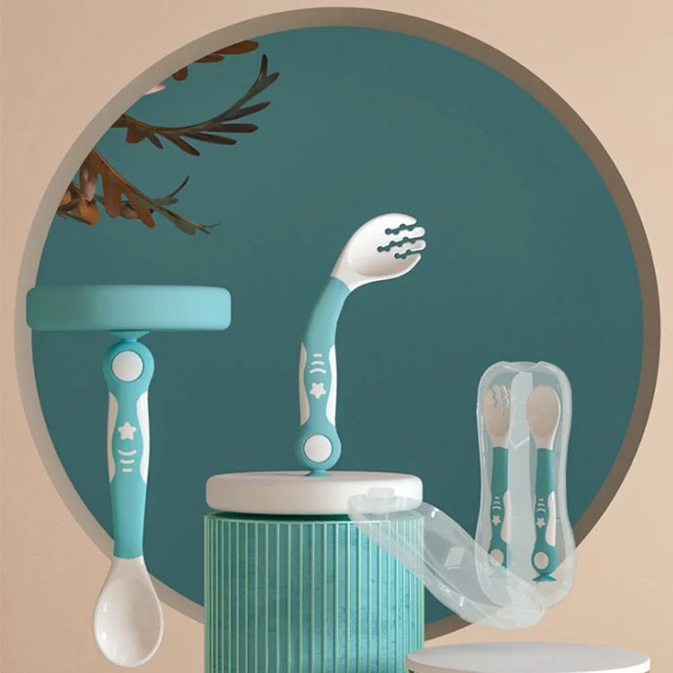 Blue standable baby spoon and fork set standing upright on a table