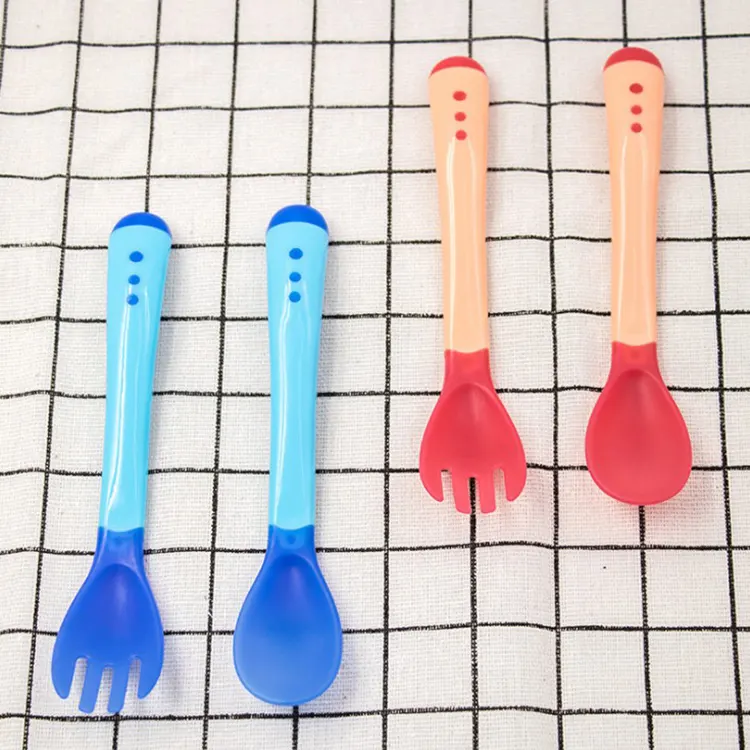 Blue baby spoon and fork set with soft TPE tips, viewed from the side