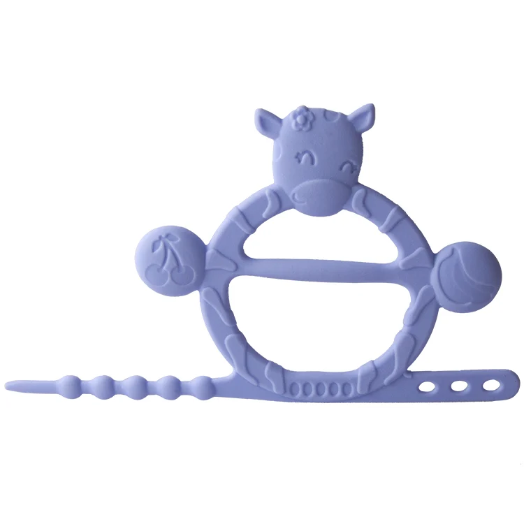 Cow-shaped teething bracelet in yellow, showing the adjustable strap loop