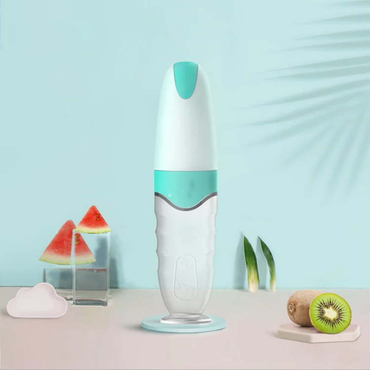 Close-up of the spoon and suction base on the feeding bottle