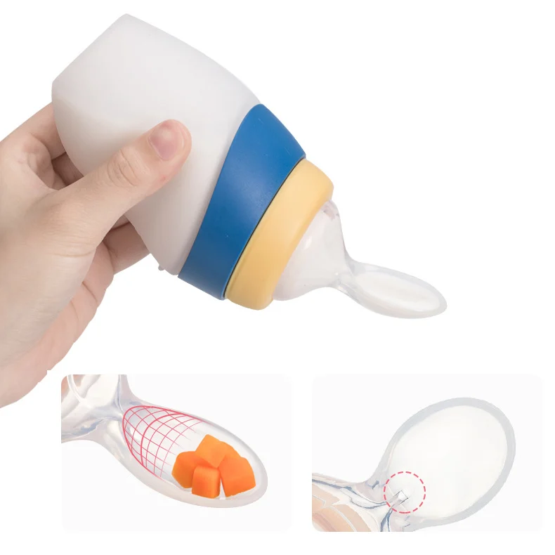 Green silicone feeding bottle with spoon and cap, side view