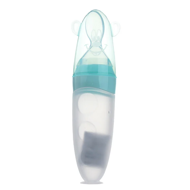 Silicone squeeze food dispenser bottle without suction base, showing the soft body and built-in spoon