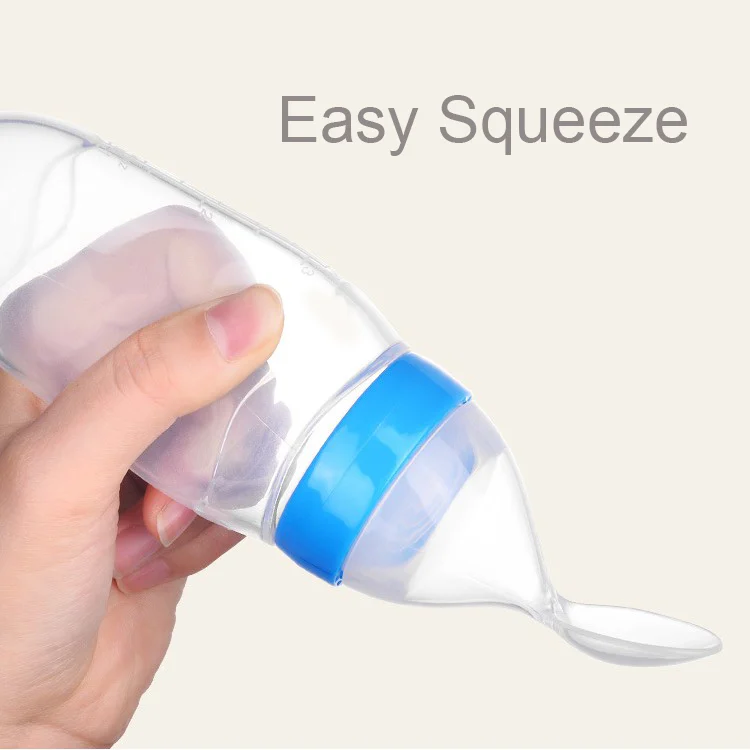 Grey feeding bottle with the cap removed, showing the spoon head and spacer